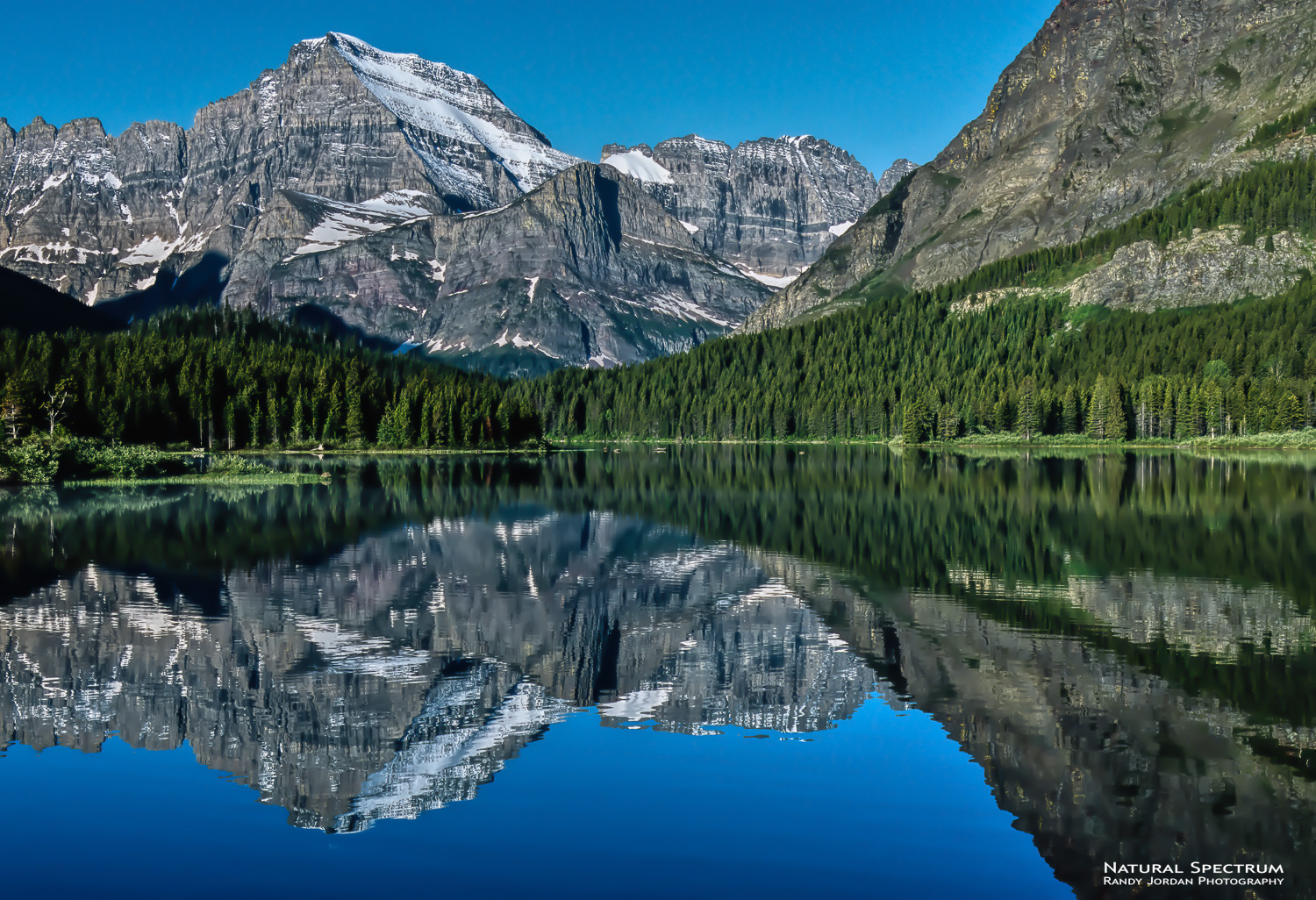 Early morning reflections on Swiftcurrent Lake, Glacier National Park, Montana.